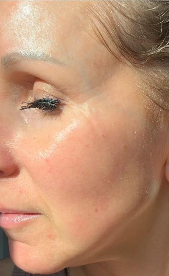 Close-up of a person's face with makeup application on the eyelid